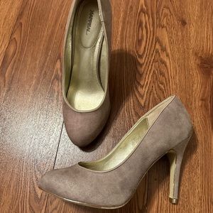 Woman’s tan suede heels